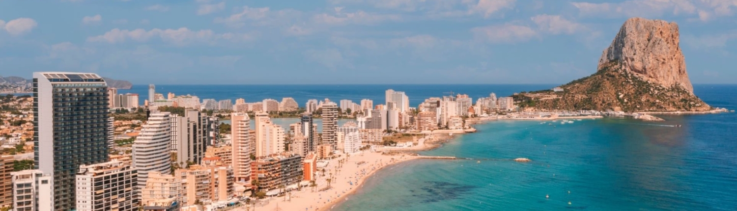 Aerial View Of Calp City With Beach And Ifach Rock In Costa Blanca Spain